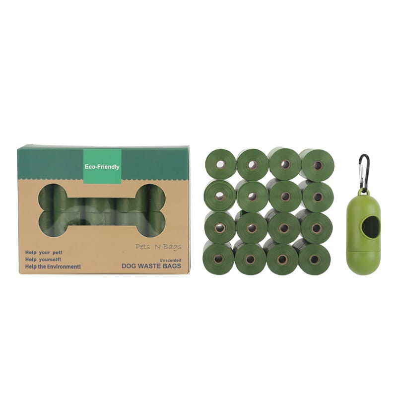 Green roll of biodegradable unscented dog waste bags in a bone-shaped eco-friendly package with a matching green dispenser for pet garbage disposal.