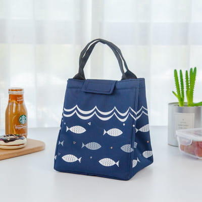 Mini cartoon oxford insulated picnic handbag in yellow with navy fish and white wave pattern featuring black handles.