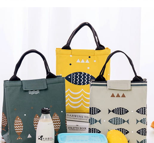 Mini cartoon oxford insulated picnic handbag in yellow with navy fish and white wave pattern featuring black handles.
