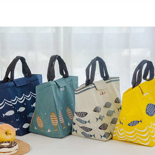 Mini cartoon oxford insulated picnic handbag in yellow with navy fish and white wave pattern featuring black handles.