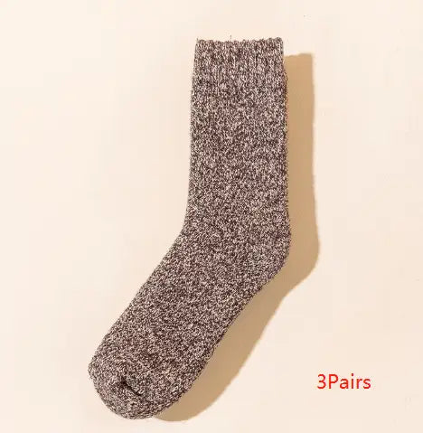 A cozy heathered gray wool sock for men featuring a thick knit texture and ribbed cuff ideal for winter warmth.