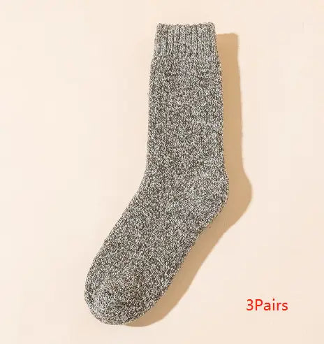 A cozy heather gray knit wool sock for men featuring a ribbed cuff and thick warm crew design for winter use.