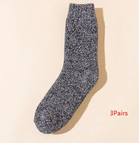 A cozy heathered gray thick wool sock for men with a ribbed cuff designed for winter warmth and crew length.