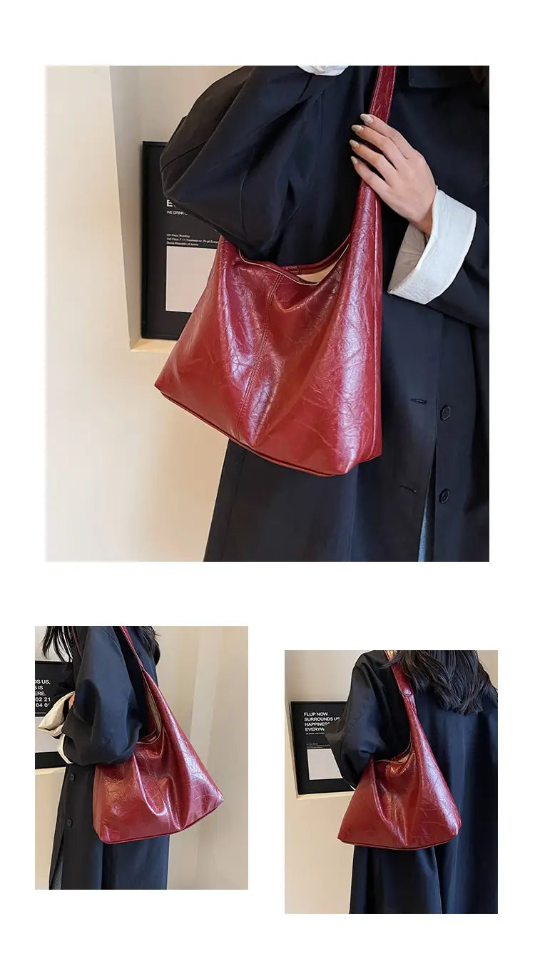 Eine glänzende rote Vintage-Leder-Tragetasche mit großer Kapazität und einem lässig-minimalistischen Schulterdesign.