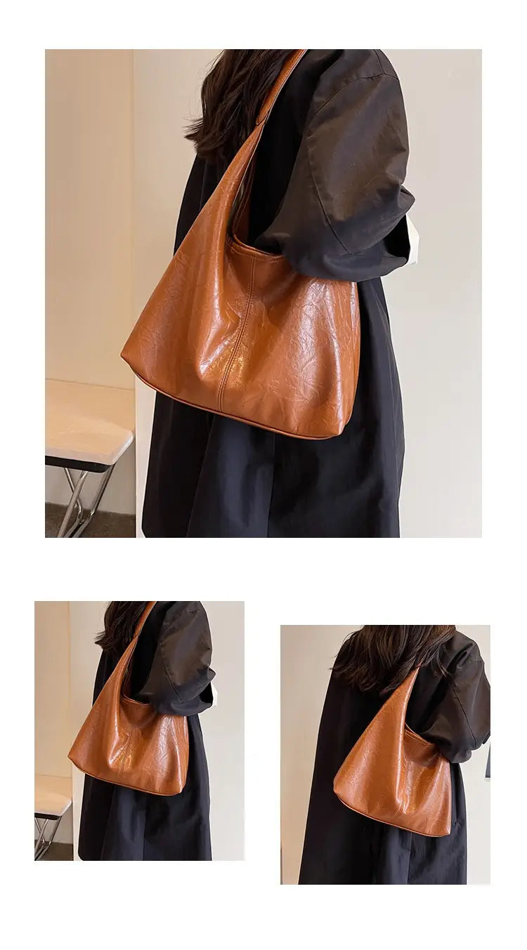 Hellbraune Vintage-Leder-Tragetasche aus Kunstleder mit großer Kapazität und einem einzelnen Schulterriemen, mit dezent geprägter Textur.