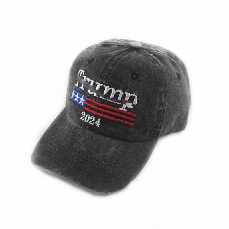 Dark gray distressed cotton baseball cap with embroidered Trump 2024 text and stylized American flag design in red white and blue, titled Trump 2024 embroidered trucker hat.
