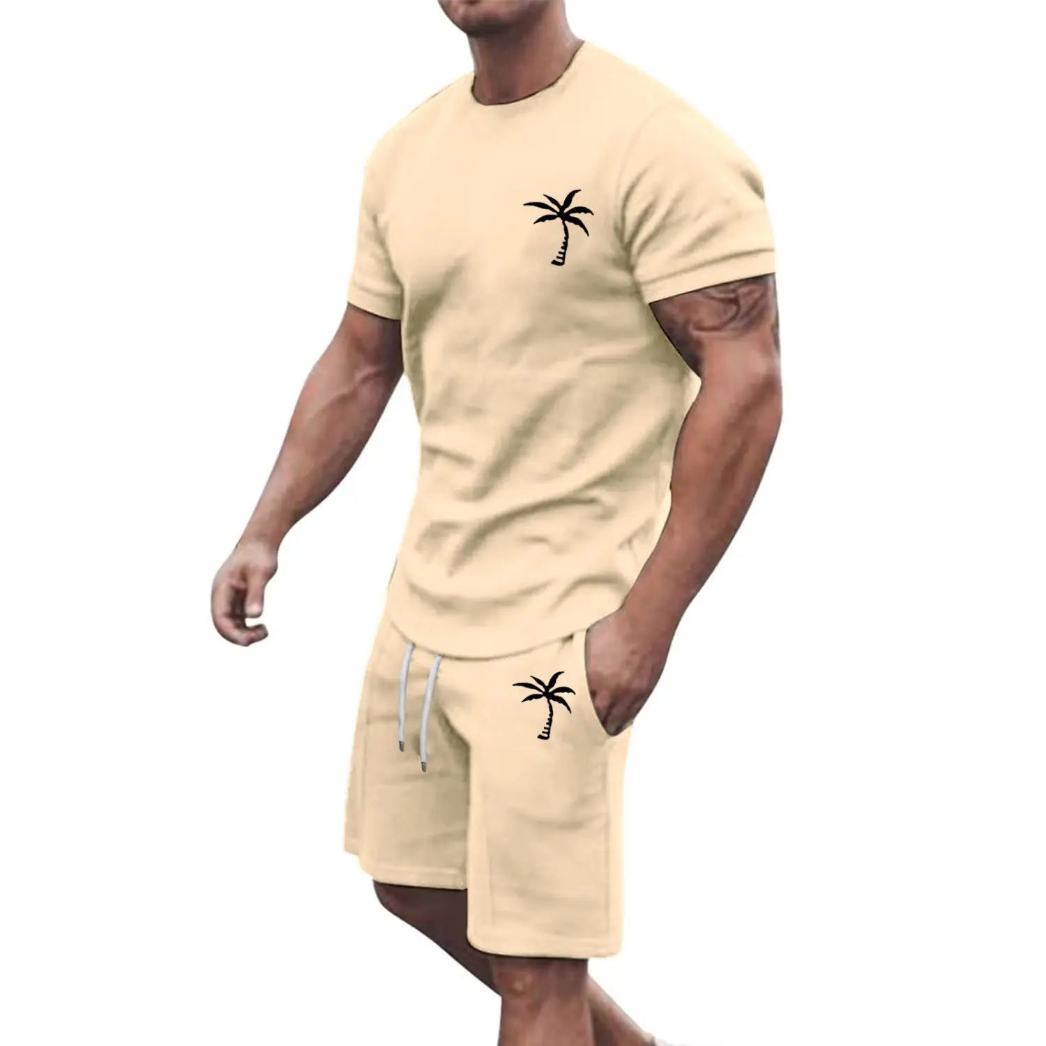 Beige tropical palm tree short sleeve athletic set featuring black palm tree embroidery on the chest and pocket designed for active wear.