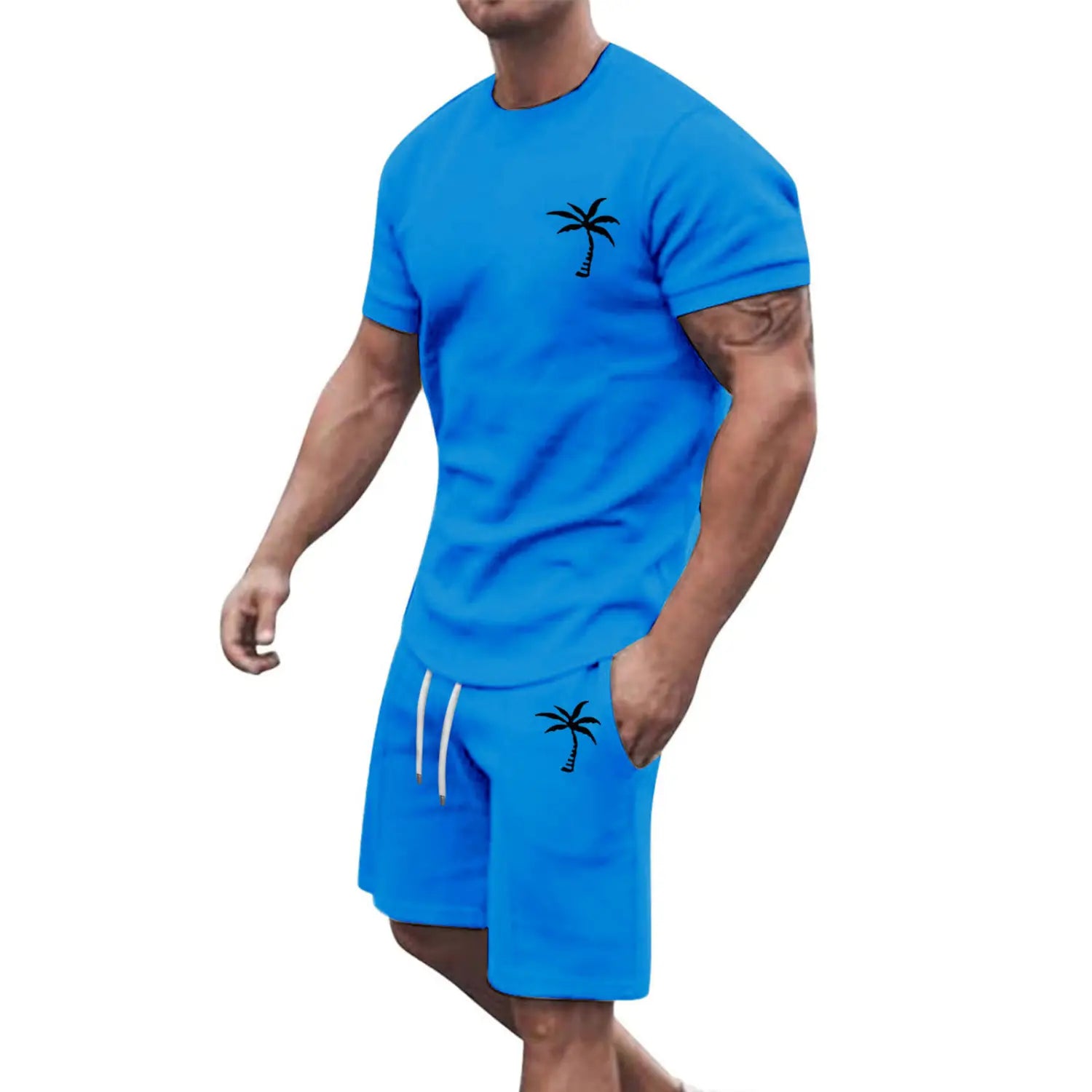 Bright blue athletic two-piece set featuring black palm tree embroidery on the chest and thigh designed for tropical and active wear.