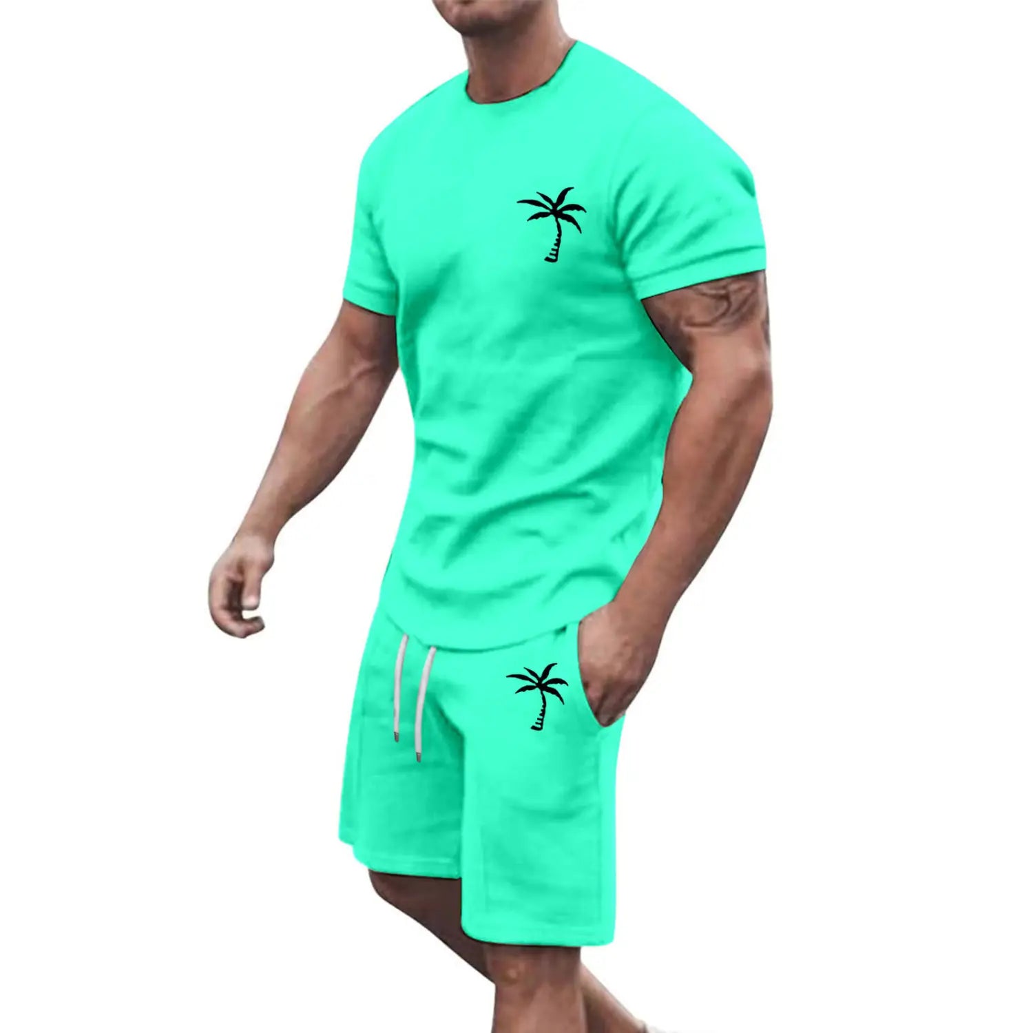 Men’s teal tropical palm tree short sleeve athletic set featuring black palm tree embroidery on the chest and shorts designed for workout use.