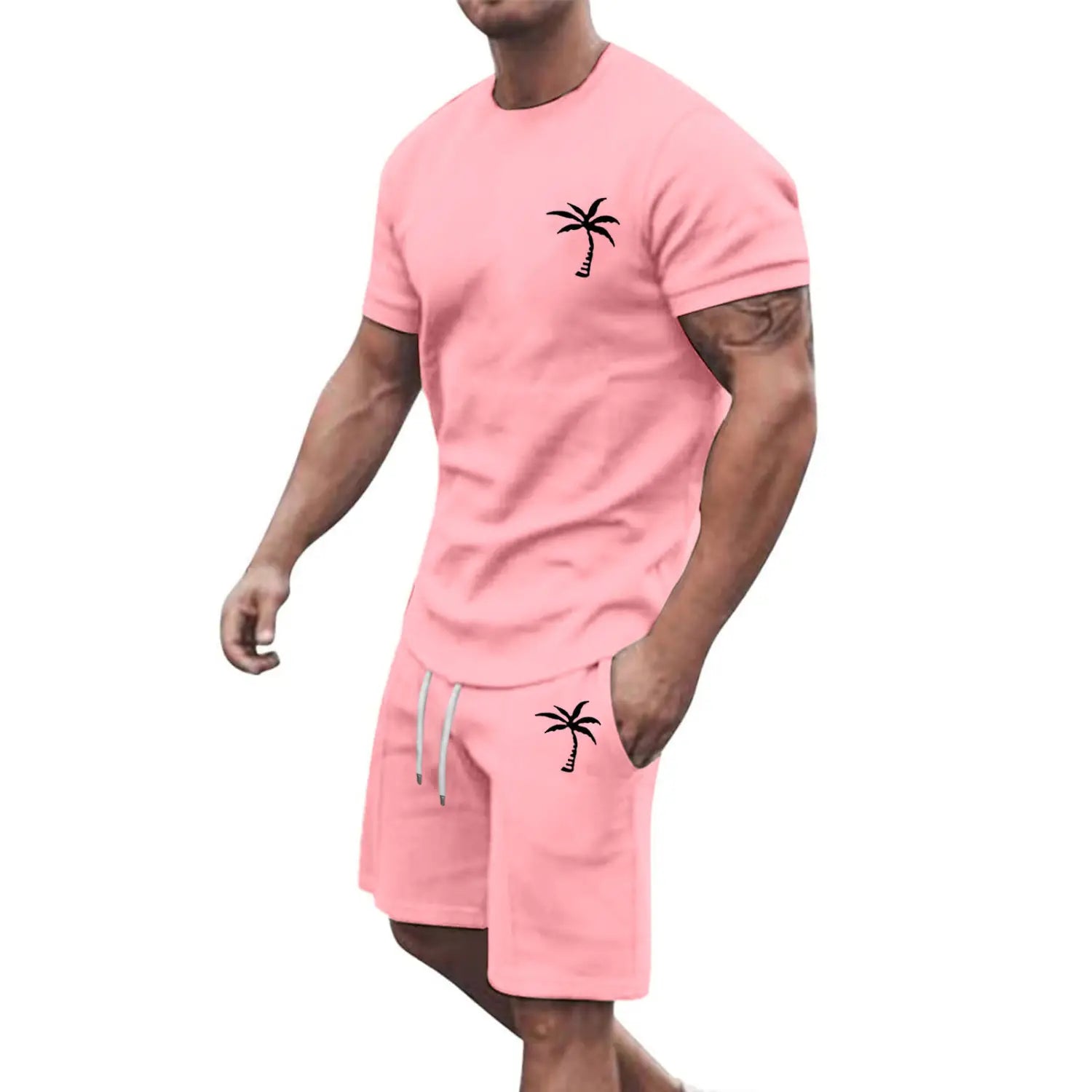Pink tropical palm tree short sleeve athletic set featuring black palm tree embroidery on the chest and pocket.