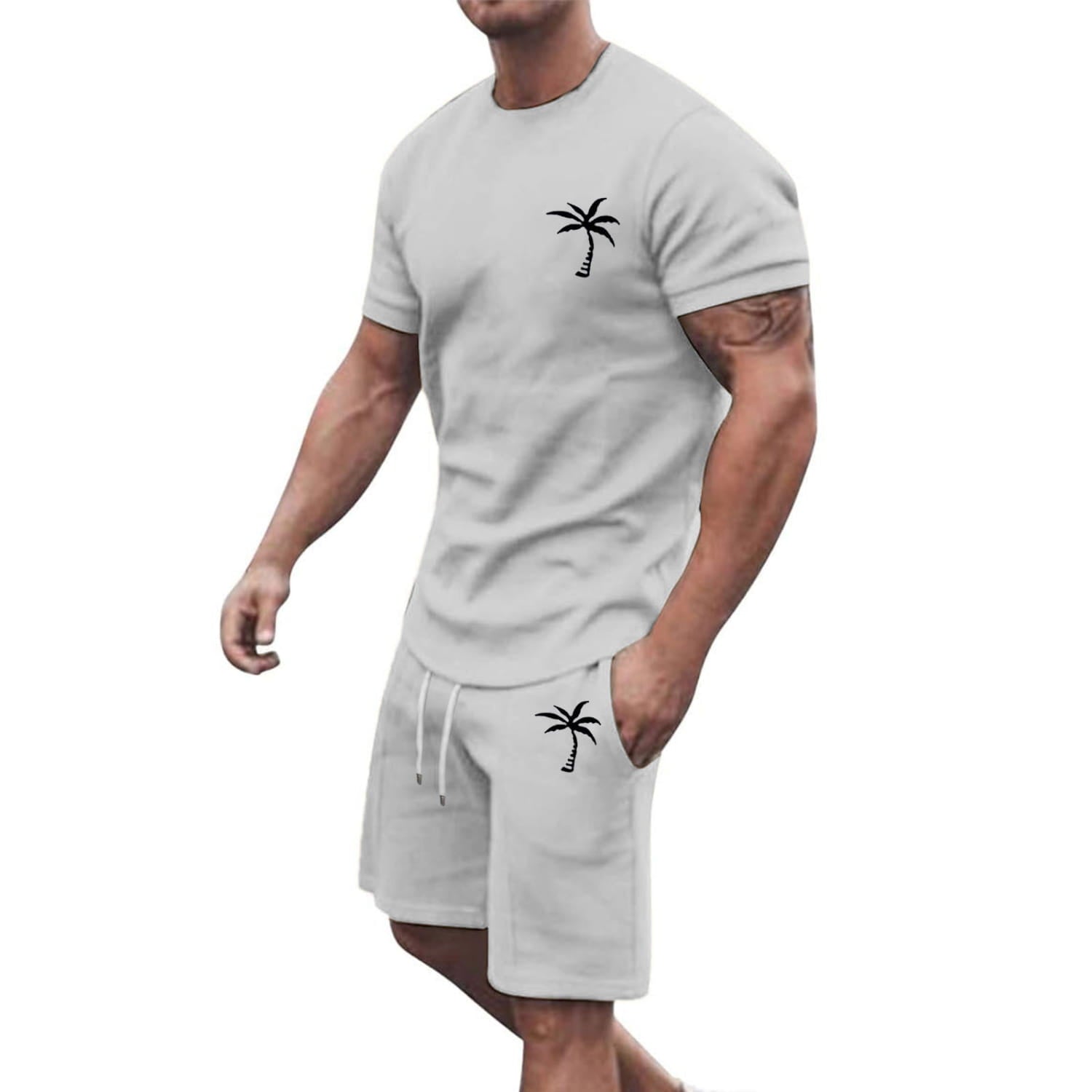 Light gray tropical-themed two-piece athletic set with short sleeves featuring black palm tree embroidery on the chest and pocket.