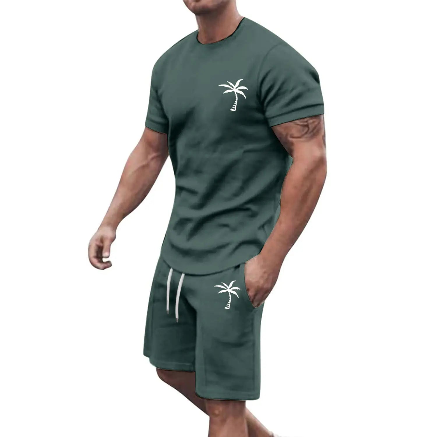 dark green tropical-themed workout set featuring a short-sleeved tee and matching shorts with white palm tree embroidery designed for athletic use.