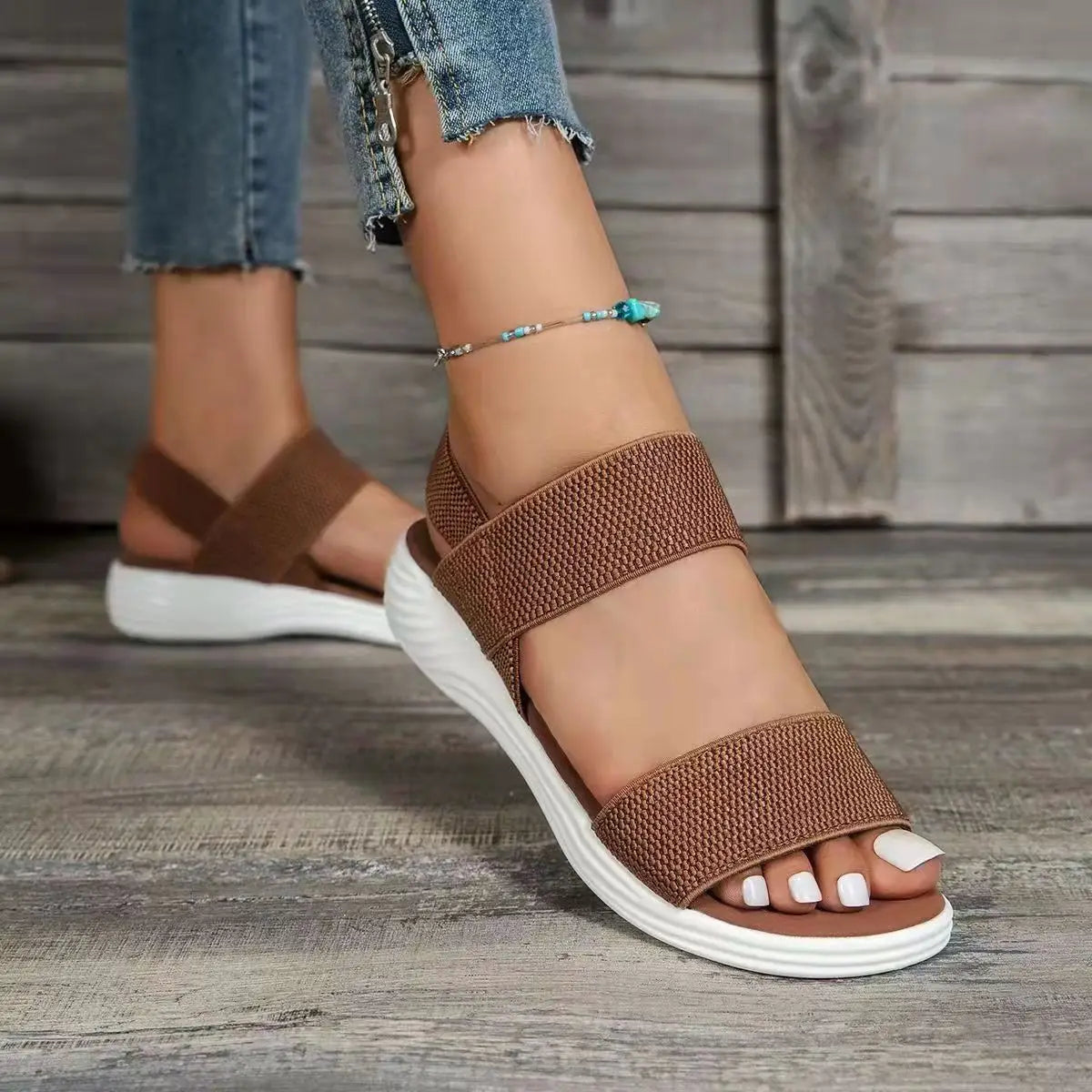 brown flyknit elastic back strap flat sandals for women with woven straps and white rubber sole