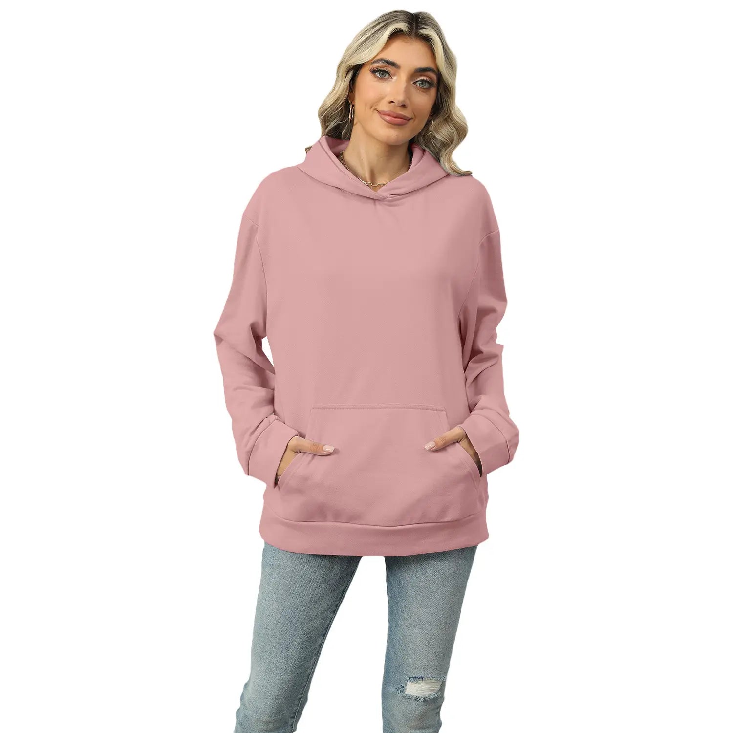 Women’s oversized heather fleece pocket hoodie in soft pink with long sleeves, front pocket, and drawstring hood.