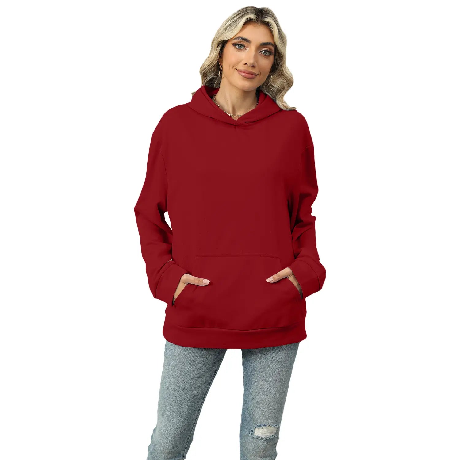 A solid red women’s oversized heather fleece hoodie with long sleeves front pocket and hood.