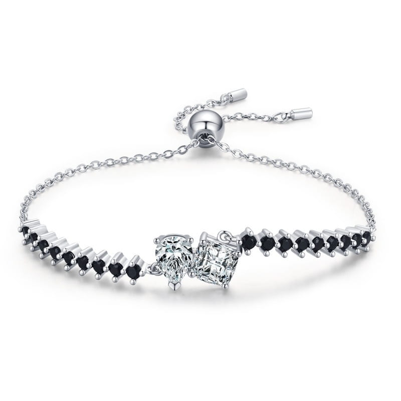 Sterling silver adjustable bracelet featuring two princess-cut clear stones and black heart-shaped gemstones set in polished metal with a magnetic clasp from the zircon heart pendant and bracelet set.