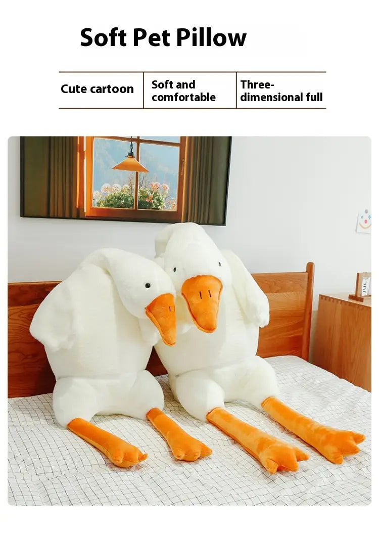 Grand coussin-peluche oie blanche en forme de corps, avec un design doux et réconfortant, des becs et des pattes orange, pour un soutien confortable des animaux de compagnie.