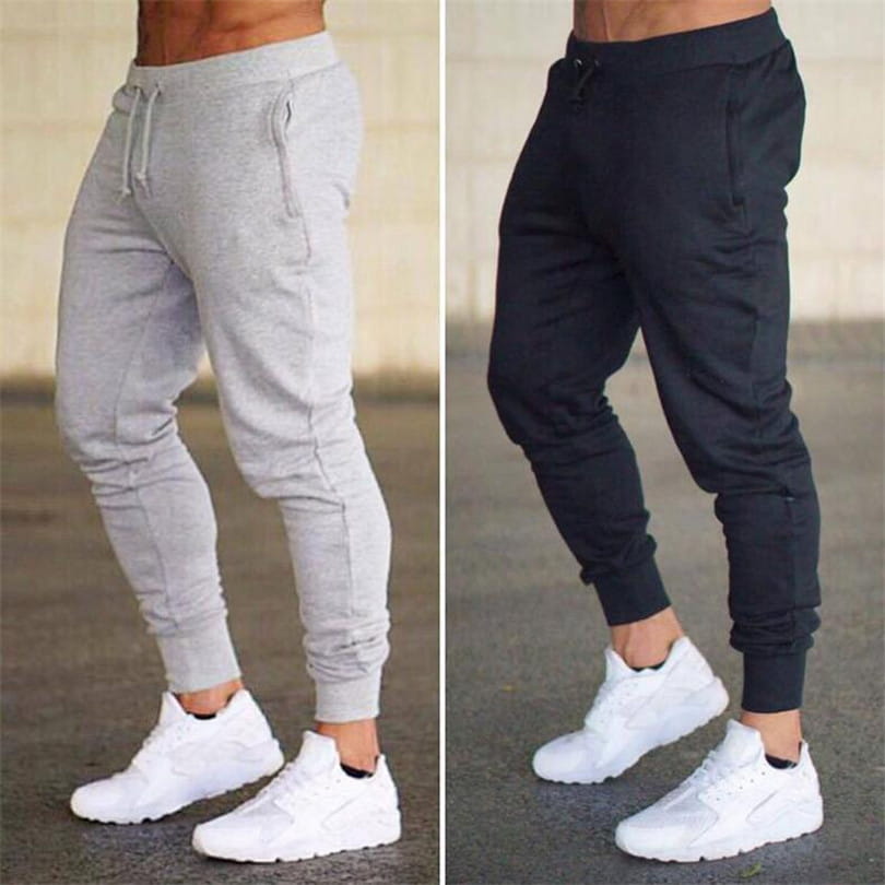 men’s athletic training jogger pants in gray and black feature elastic cuffs side pockets and waist drawstrings for comfortable workout wear.