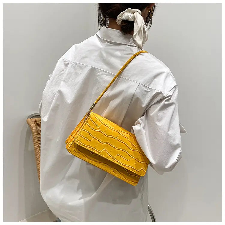 Vibrant yellow crocodile pattern underarm bag made of high-end pu leather featuring a glossy textured finish and a matching crossbody strap.
