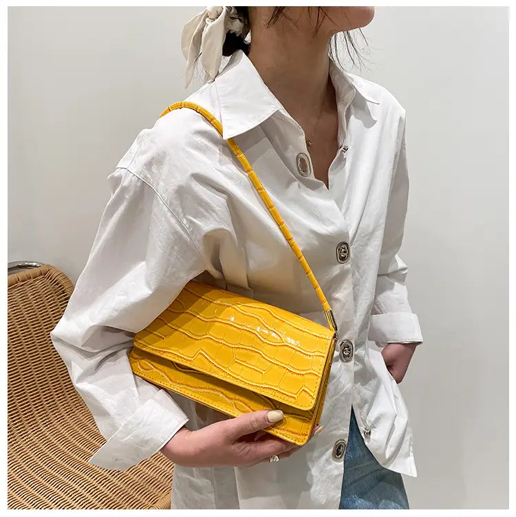 Bright yellow crocodile-embossed pu underarm bag with a matching shoulder strap and high-end clutch design.