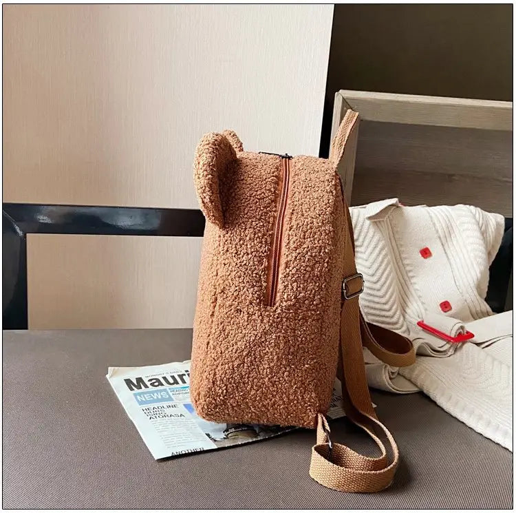 cute tan teddy bear shaped backpack made of plush fuzzy fleece with matching straps for everyday use