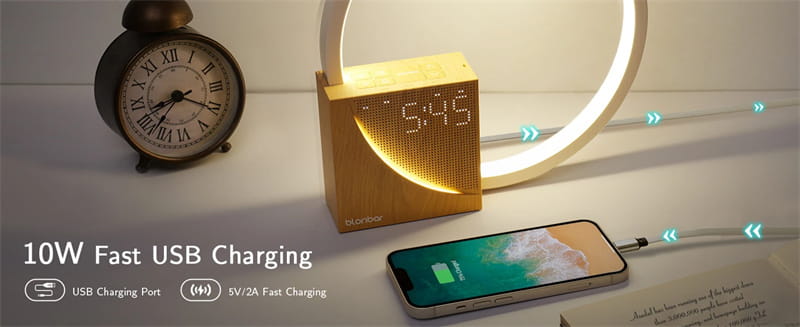 gold-colored square-shaped wireless charging pad with digital display and circular light ring featured as part of an led bedside lamp with alarm clock and natural sounds