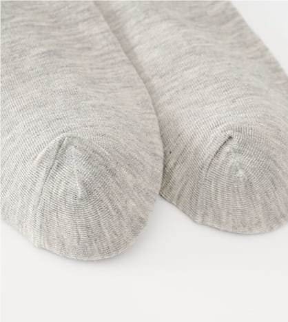 A pair of mens cotton casual crew socks in heather gray with a soft-knit breathable fabric and subtle textured pattern.