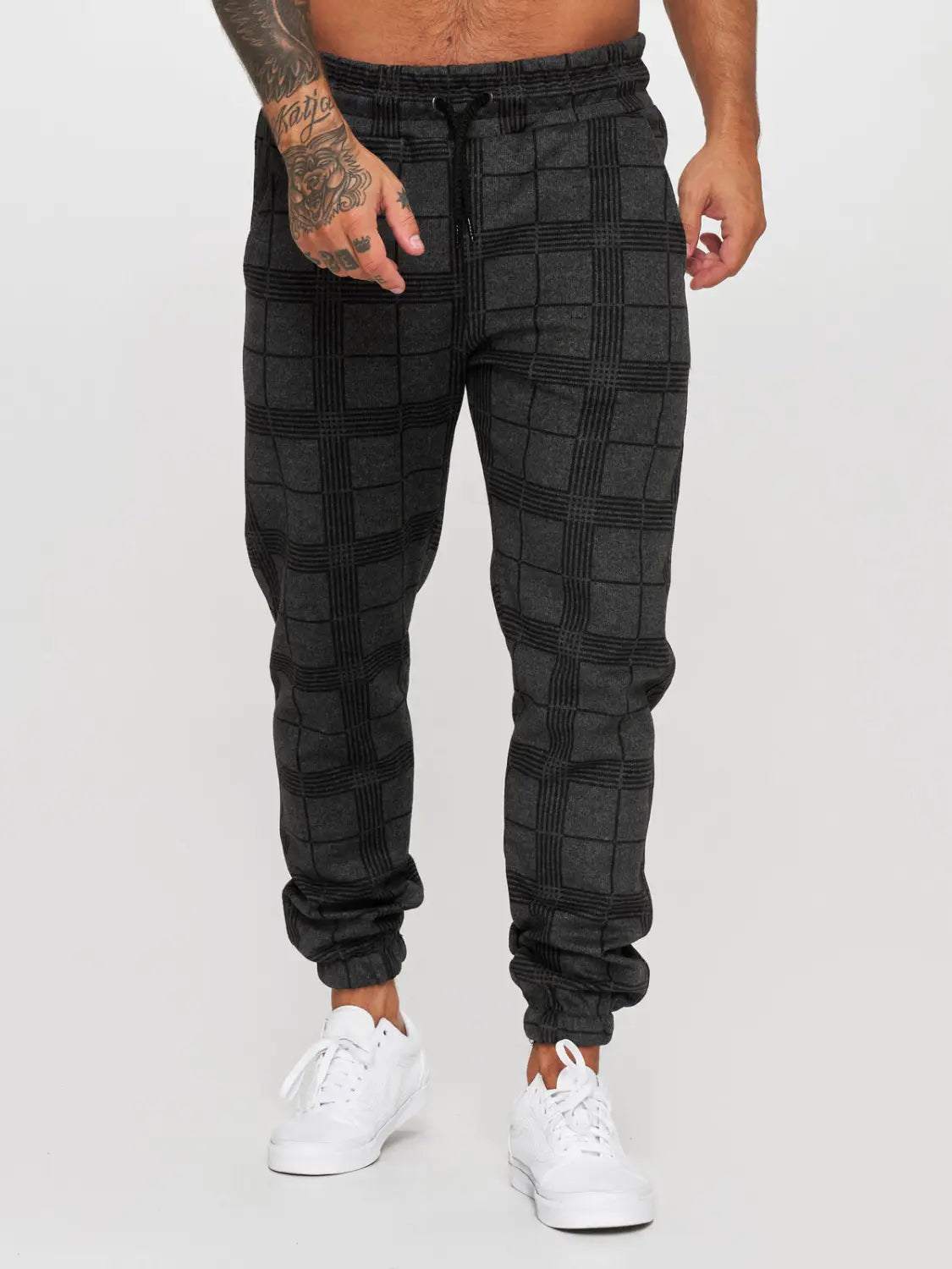 Black plaid checkered jogger pants men featuring a drawstring waistband and elastic cuffs for comfortable casual wear.