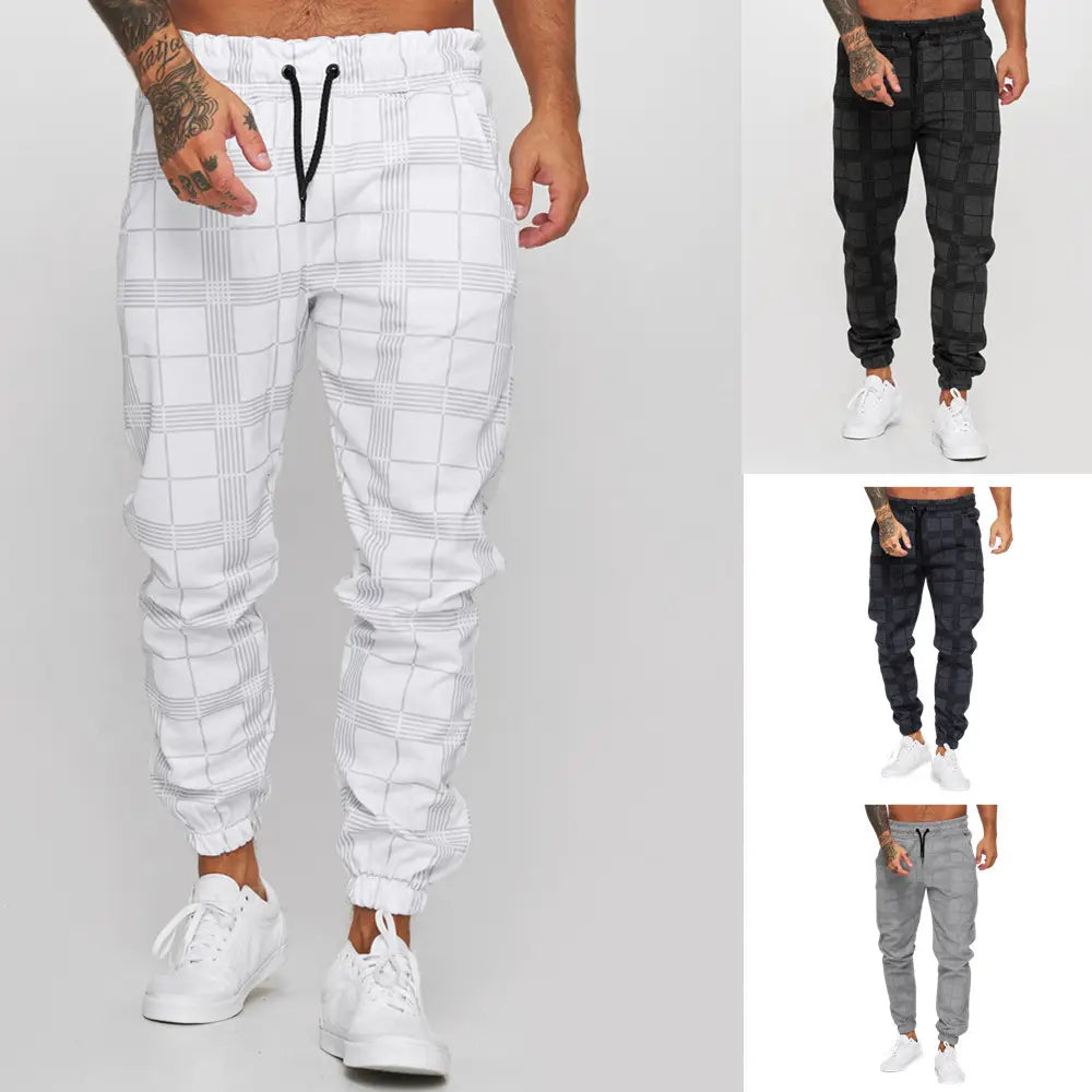 White plaid jogger pants for men featuring a black drawstring waistband and elastic cuffs.