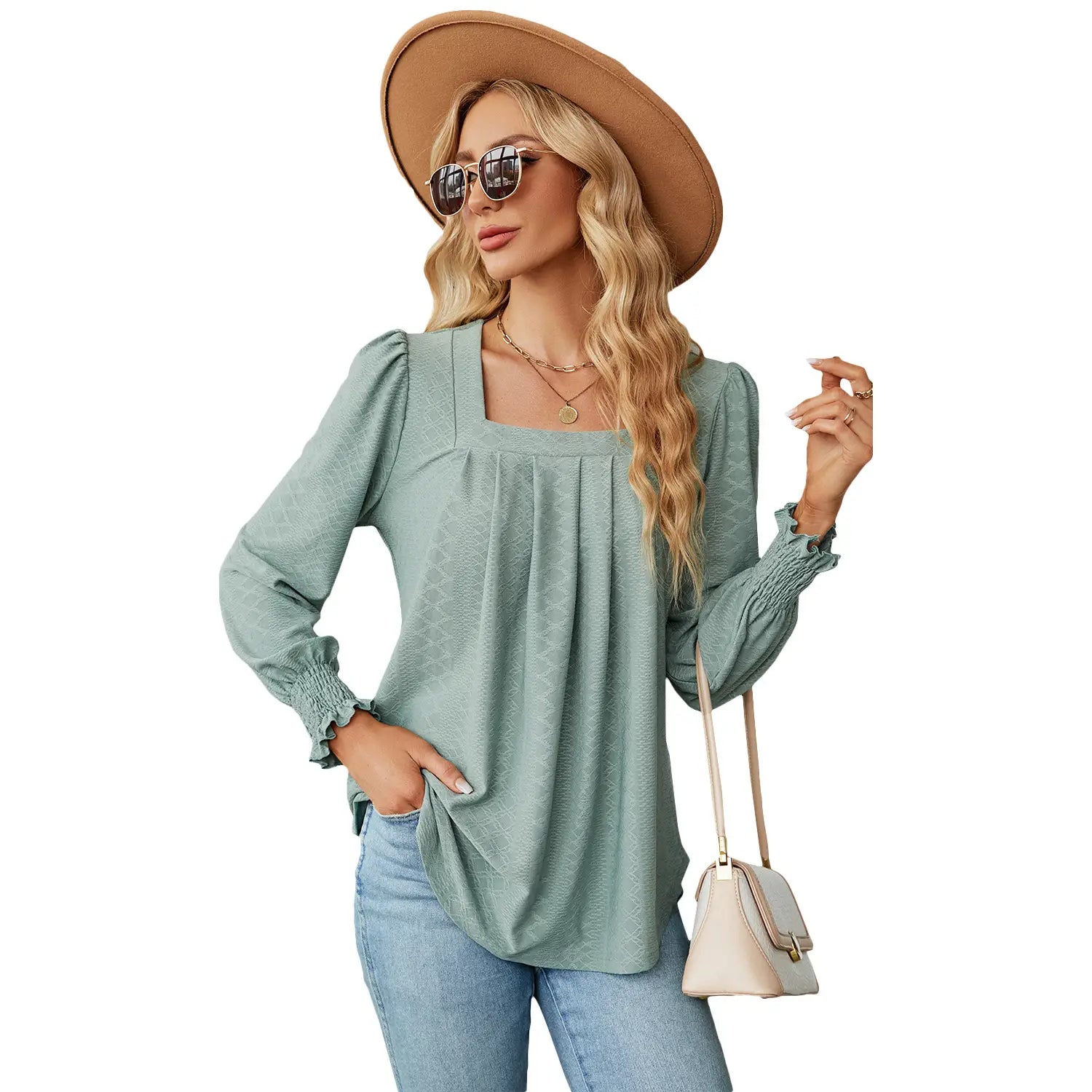 A soft sage green long-sleeved jacquard blouse for women featuring a square neckline pleated swallowtail design with gathered cuffs.