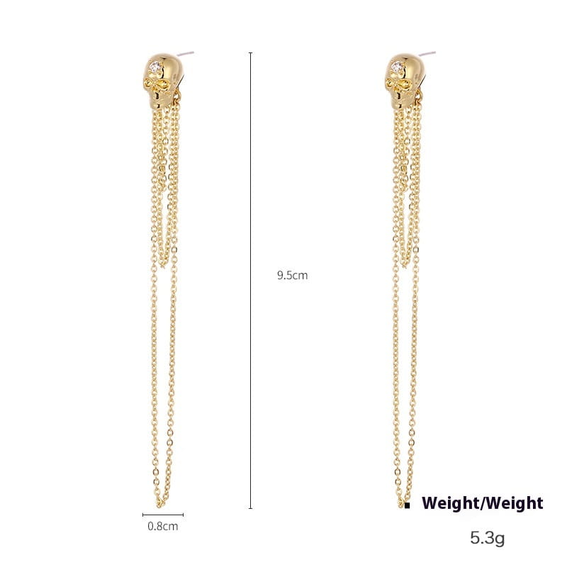 aretes de borla de calavera de oro con cadenas colgantes y un pequeño acento de zirconio en la frente