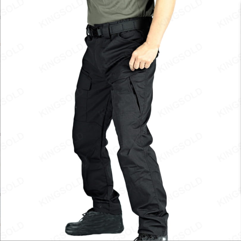 Black tactical cargo pants made of durable waterproof fabric with multiple cargo pockets designed for work and outdoor use.