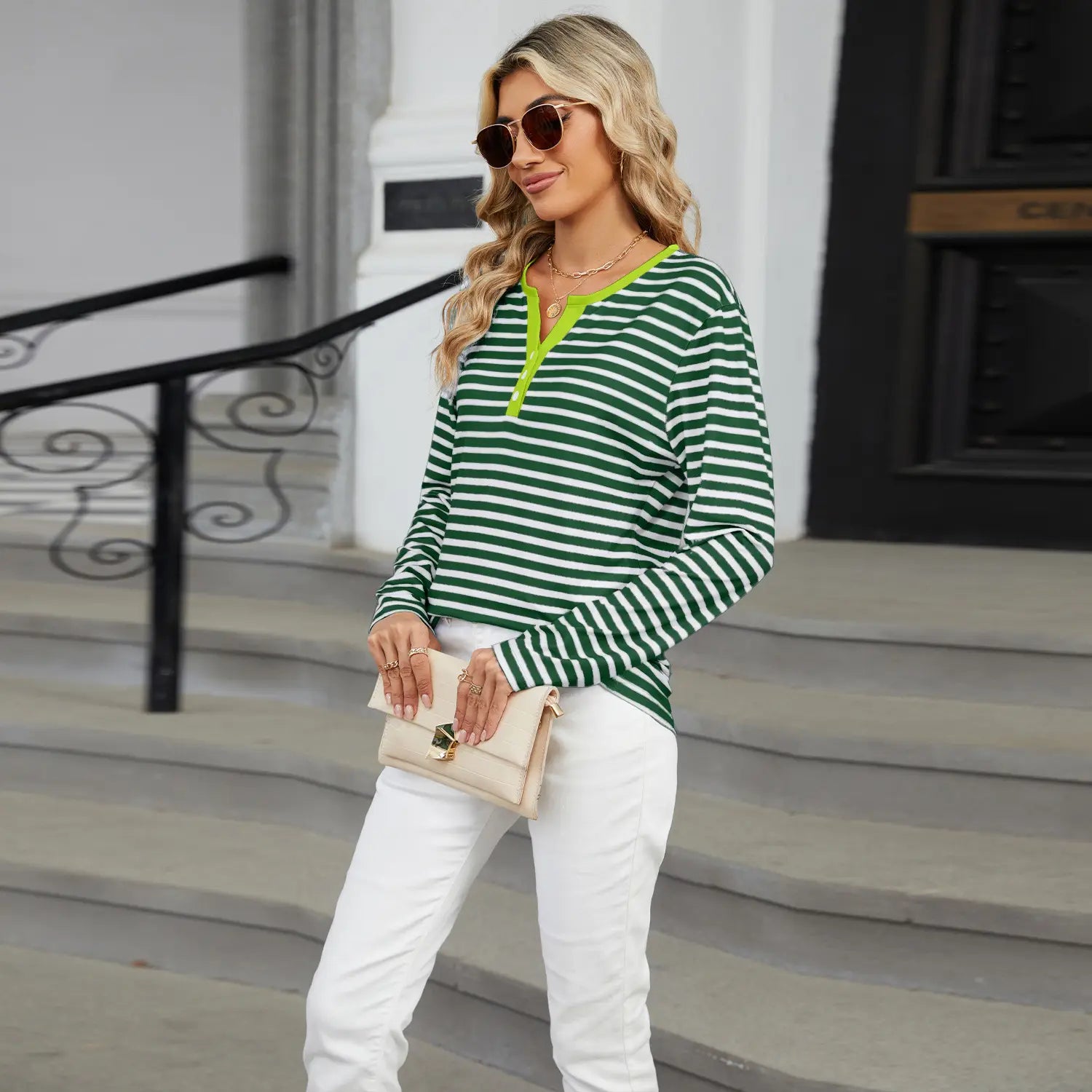 Green and white striped long-sleeved henley top with neon yellow placket featuring a v neck design for casual wear.