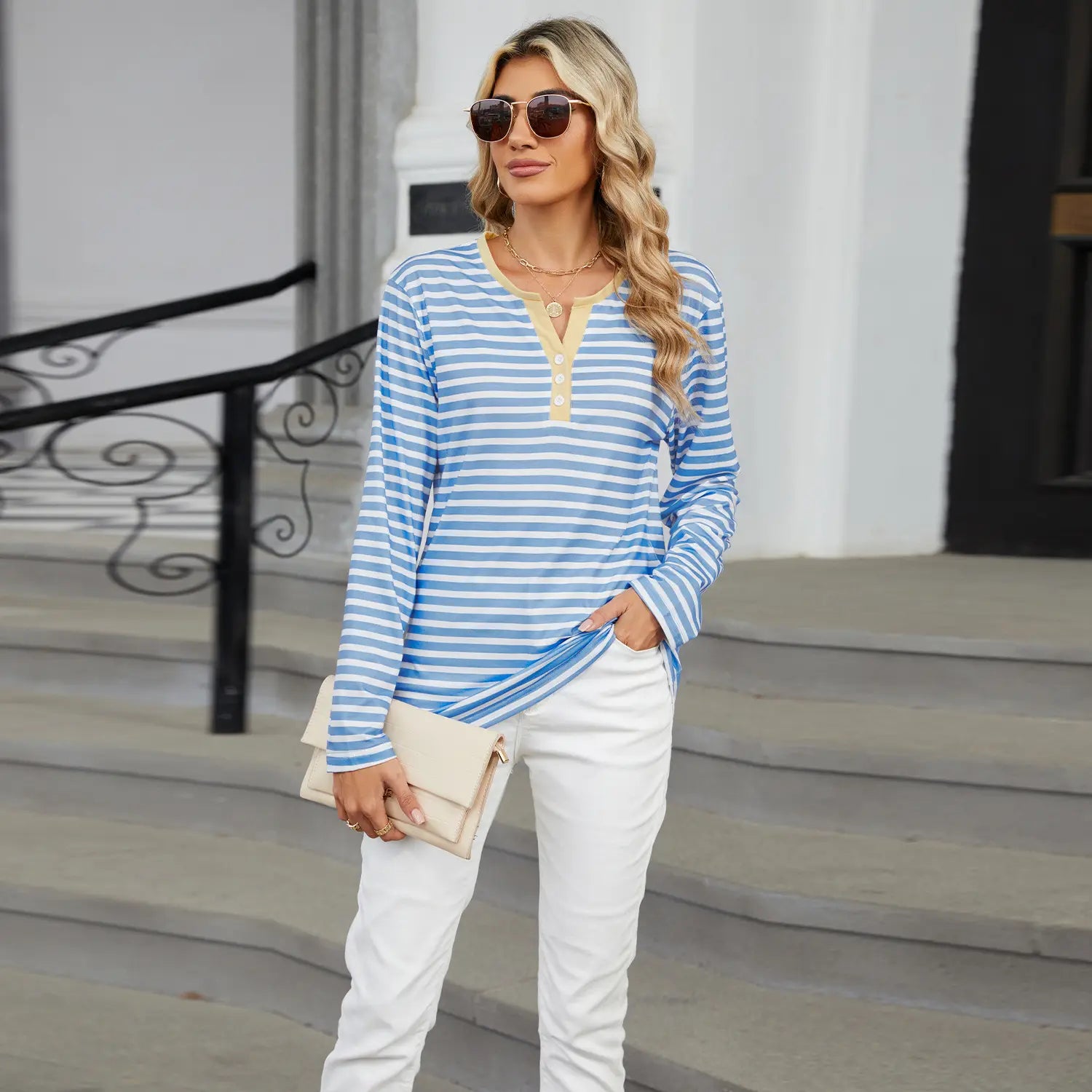 Blue and white striped long sleeve henley top with a beige collar and button placket featured in the striped contrast henley long sleeve v neck t shirt collection.