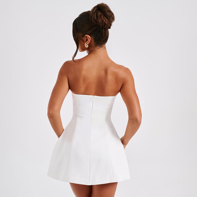White strapless a-line mini dress with fitted bodice and flared skirt designed for women.