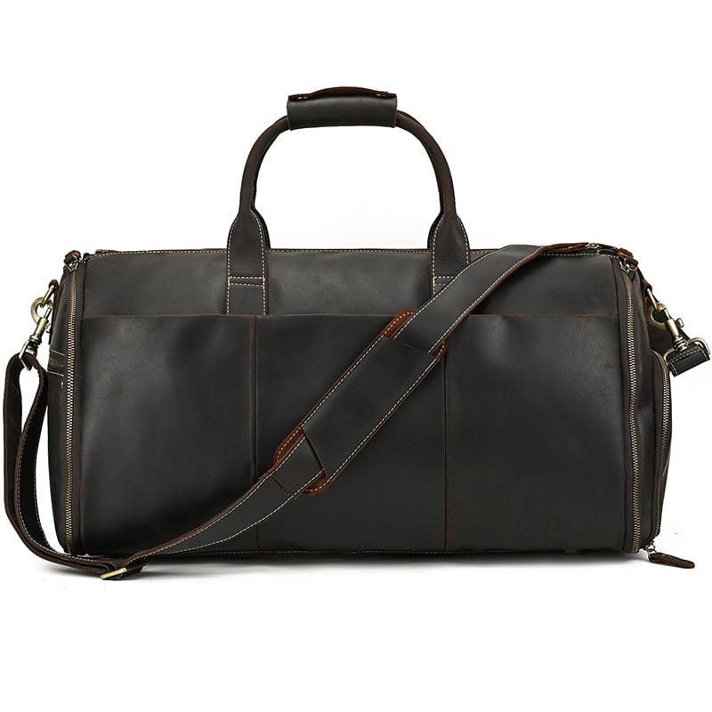Dark brown leather duffle bag with contrasting tan stitching and adjustable shoulder strap designed as a vintage large folding travel bag.