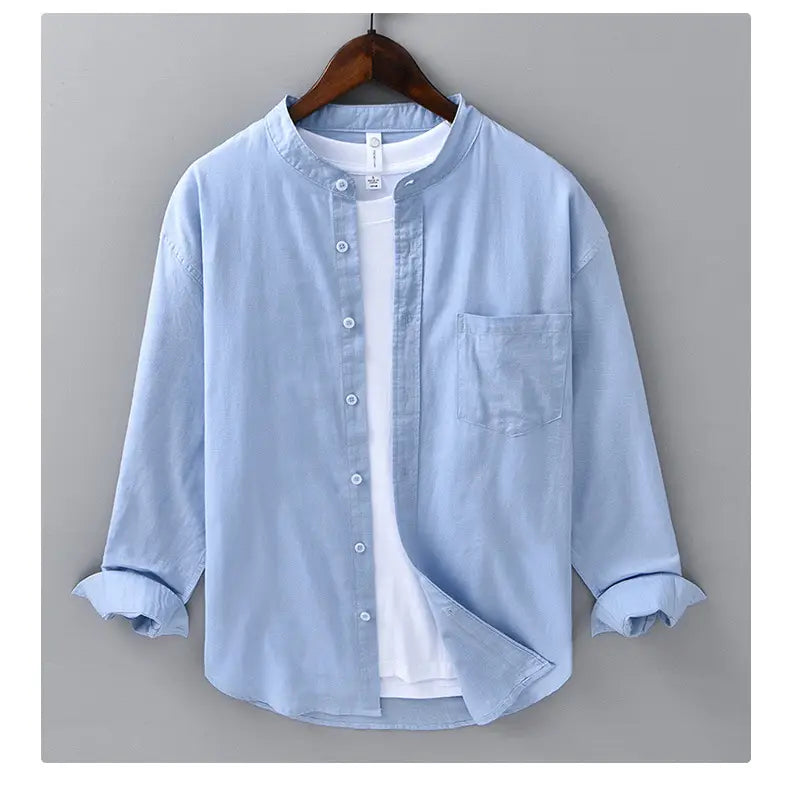 Light blue Chinese style linen mandarin collar shirt for men with long sleeves, button-up front, and rolled cuffs.