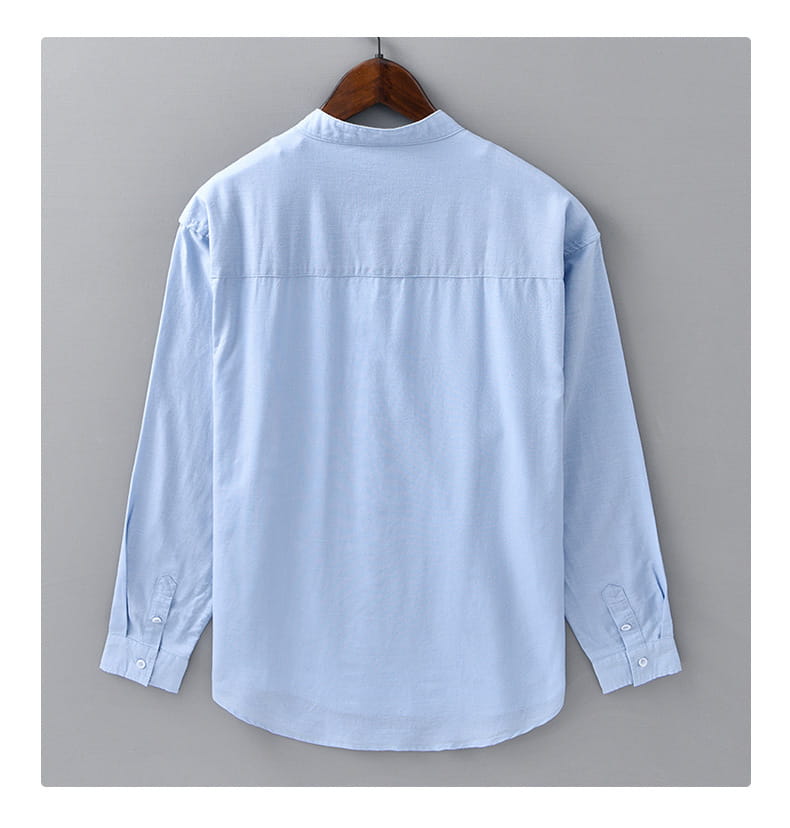 light blue long-sleeved Chinese style linen shirt for men with a mandarin collar and button-up front.