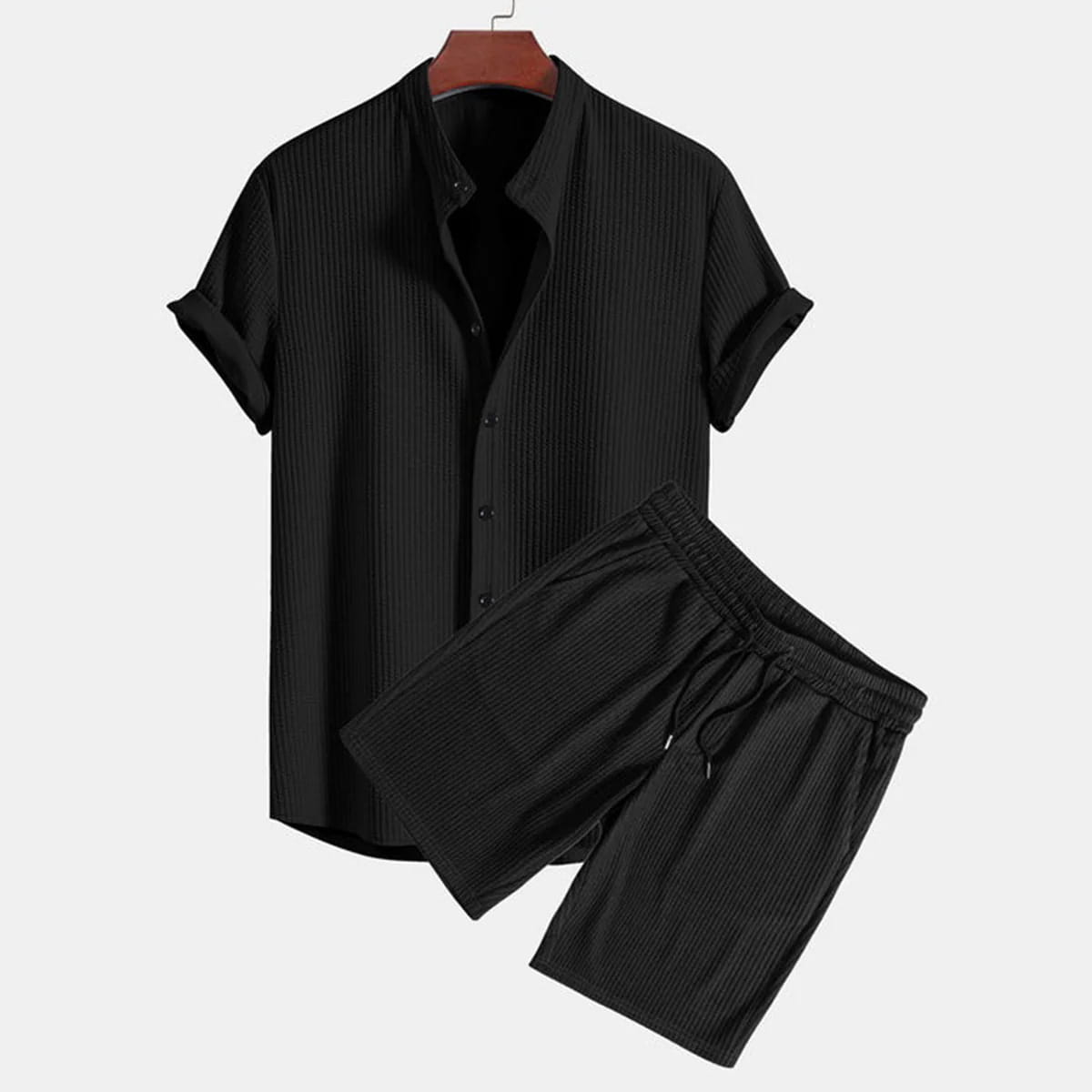 Men ribbed matching short set featuring a black short-sleeved button-up shirt and shorts with a vertical ribbed texture.