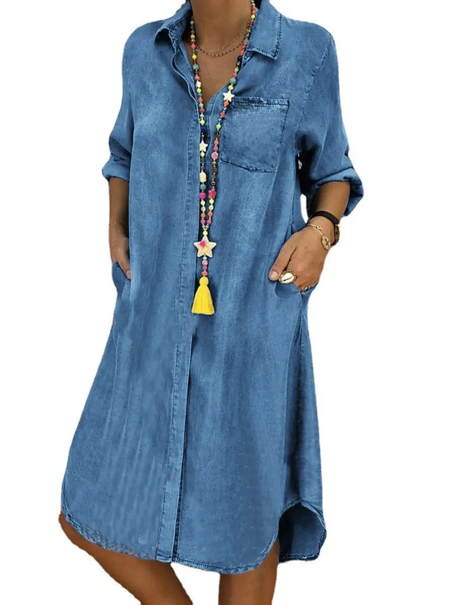 A blue denim shirt dress for women featuring rolled sleeves and a front button closure.
