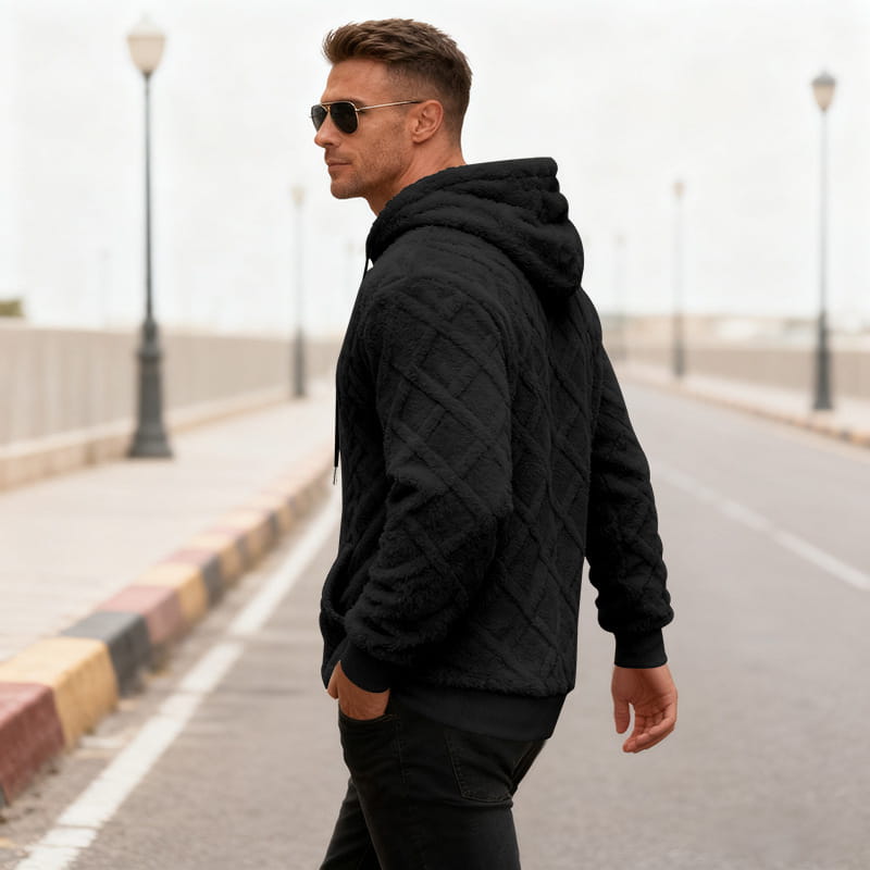 Men’s black quilted hoodie with diamond pattern textured fleece lined knit fabric and ribbed cuffs.