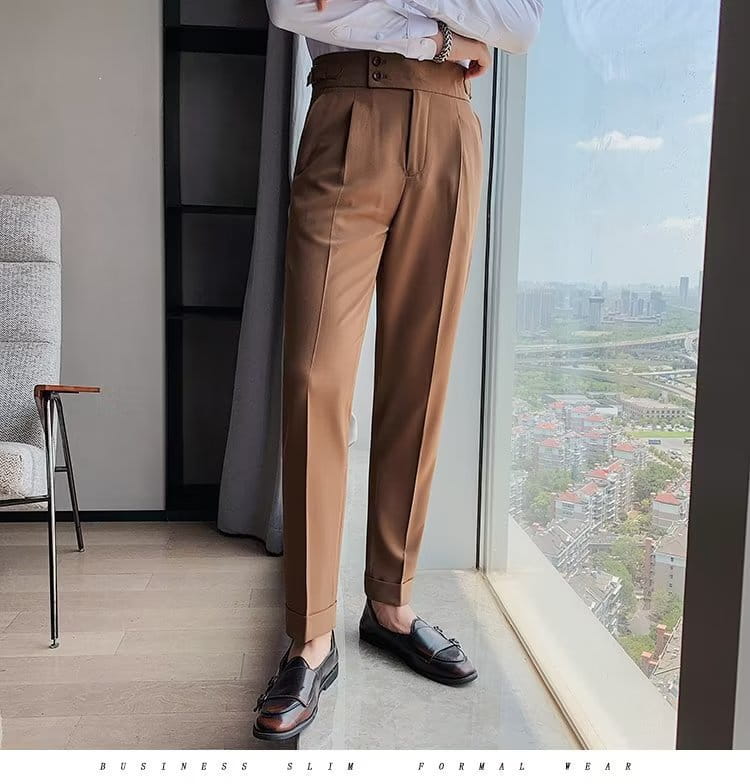 Tan Korean style slim fit men trousers featuring a high waist and pleated front in a business design