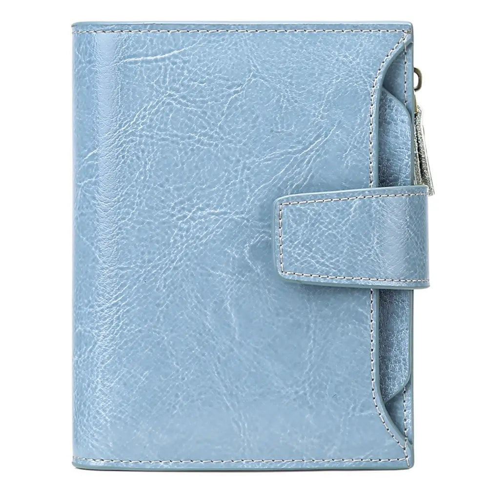 Light blue faux leather RFID wallet with zipper closure and anti theft feature shown with flap closure.