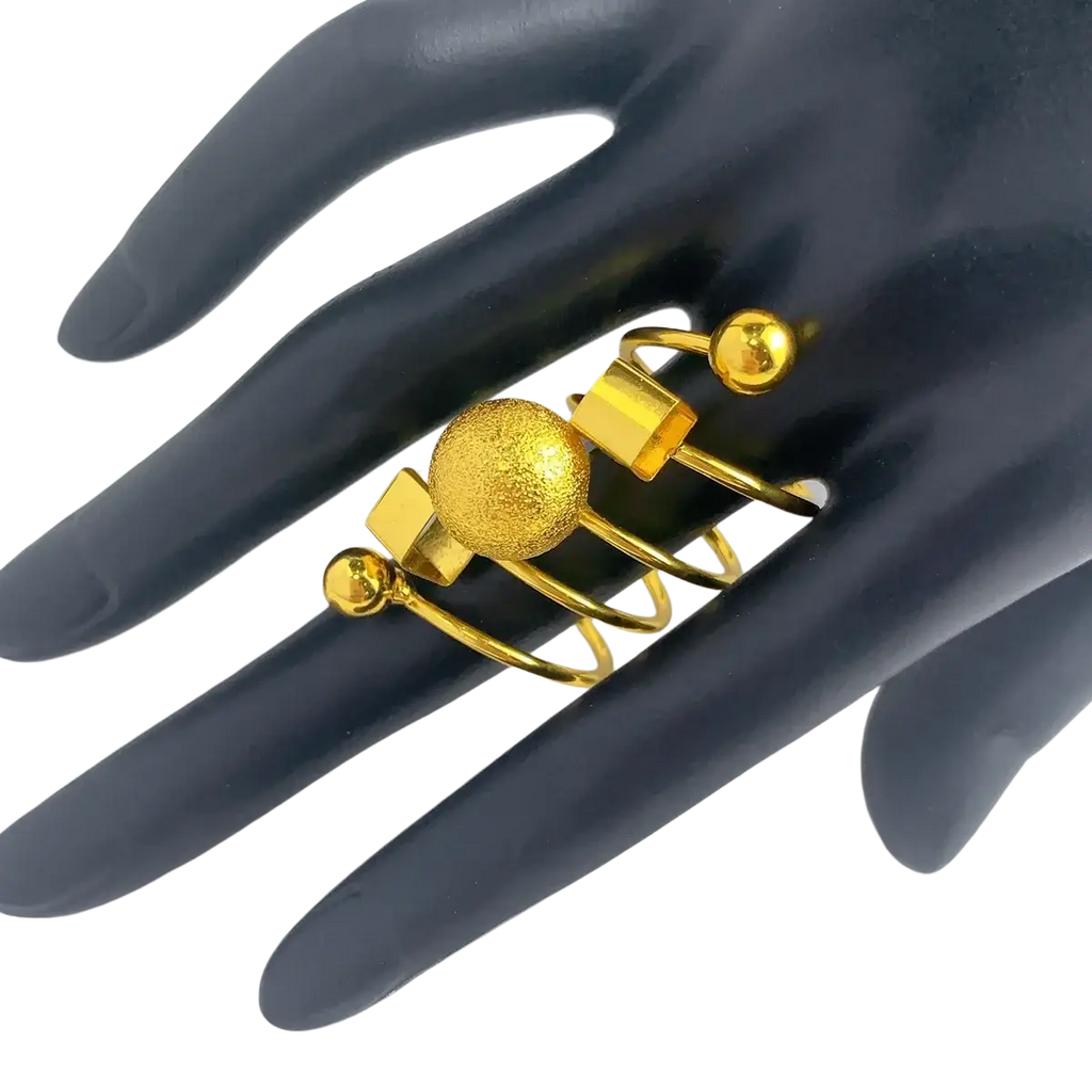 24k gold plated dubai jewelry spiral ring set with textured sphere square facets and spherical accents on interlocking bands