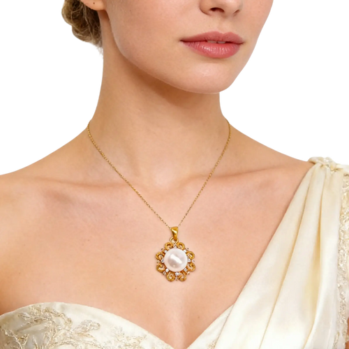 A 24k gold sun and pearl floral pendant necklace with a central pearl encased in a diamond-adorned flower setting