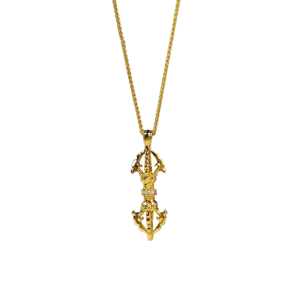 24k gold vajra pendant necklace with intricate detailing and a row of small diamonds along the center