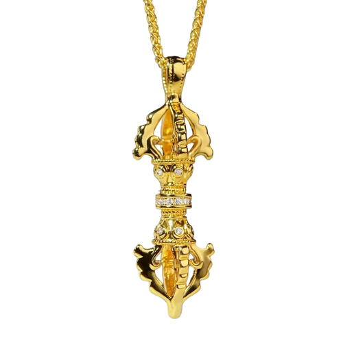 Golden 24k gold vajra pendant encrusted with diamonds on a twisted gold chain necklace