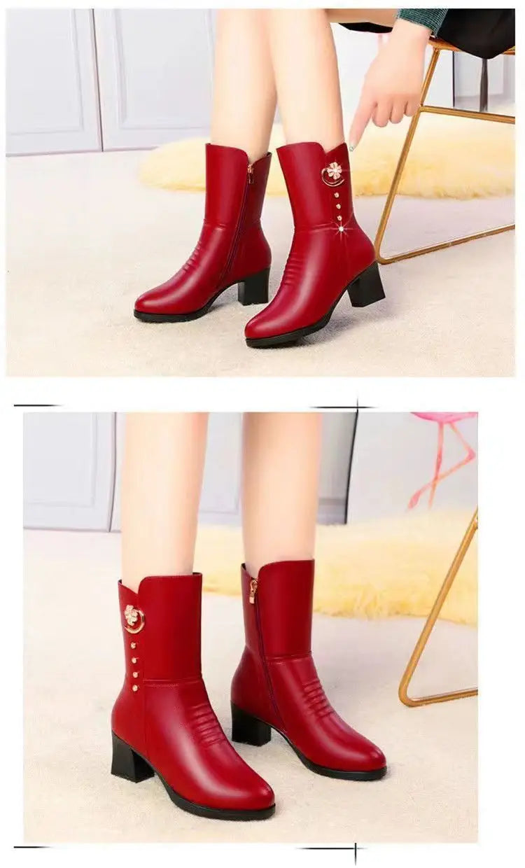 Women’s leather martin boots in red with a gold floral brooch and three decorative studs on the outer side.
