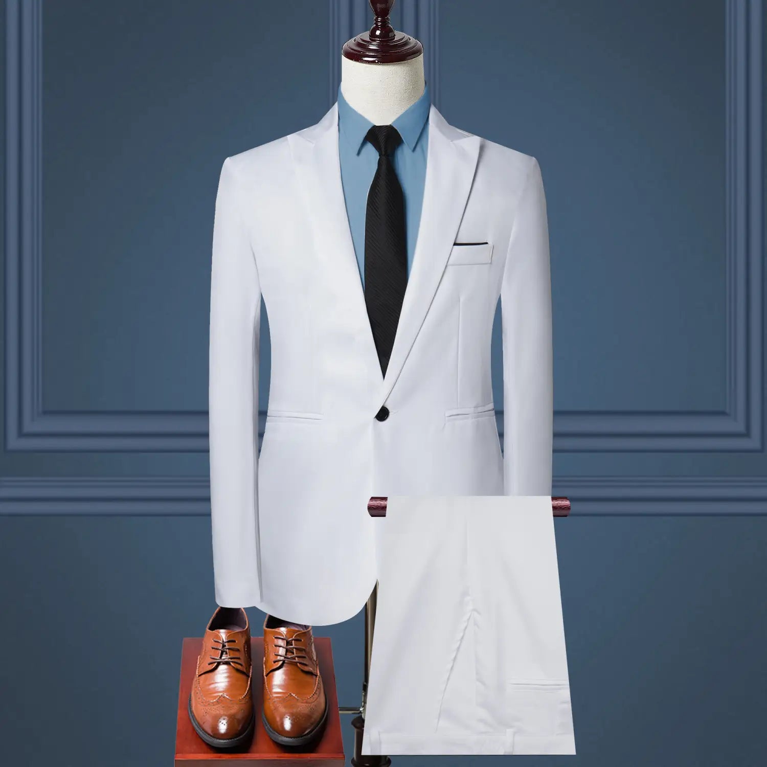 white tailored suit jacket with black button and matching pocket square displayed on a mannequin as part of a men solid color two piece leisure suit