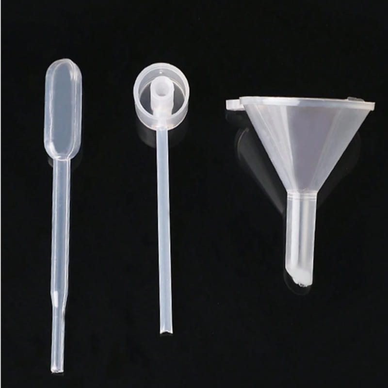 clear plastic essential oil dispenser tool set featuring a dropper pipette with bulb and funnel for precise liquid transfer